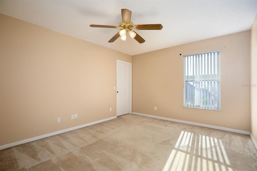 upstairs bedroom with walk in closet