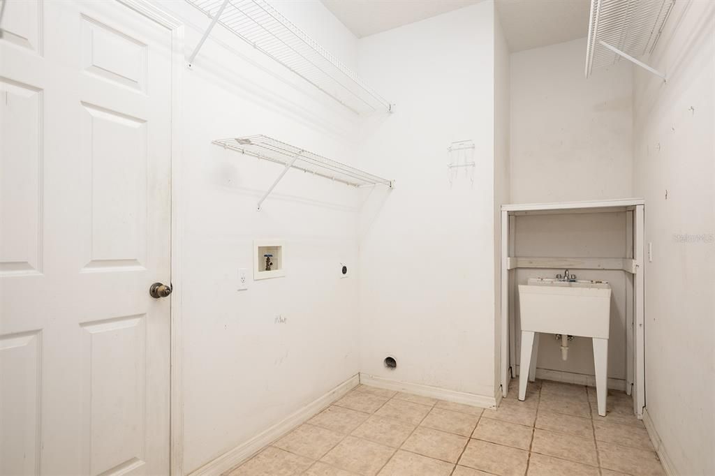 laundry room also has access to a half bath