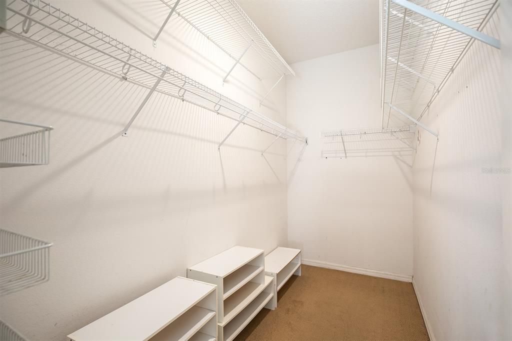 long and spacious closet in primary bedroom