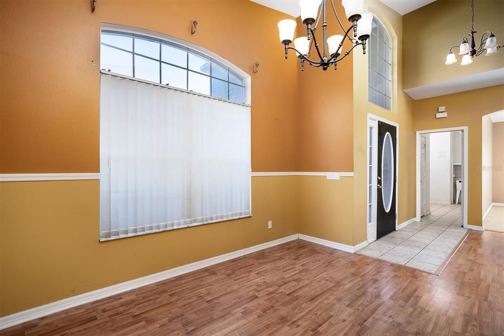 laundry room leads to the garage. also view of entrance to office/den