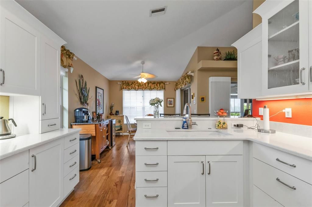 ARTIC WHITES QUARTZ TOPS ...OPENS TO THE DINING AREA