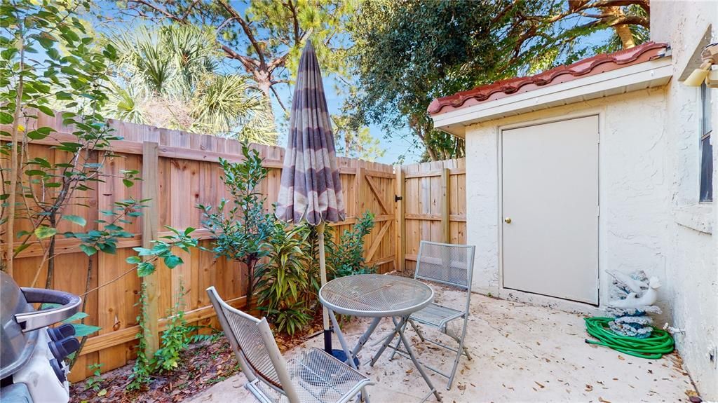 Upon stepping into the patio, you'll find a charming, private outdoor space with greenery and natural light, creating a peaceful atmosphere perfect for relaxing or enjoying the fresh air.