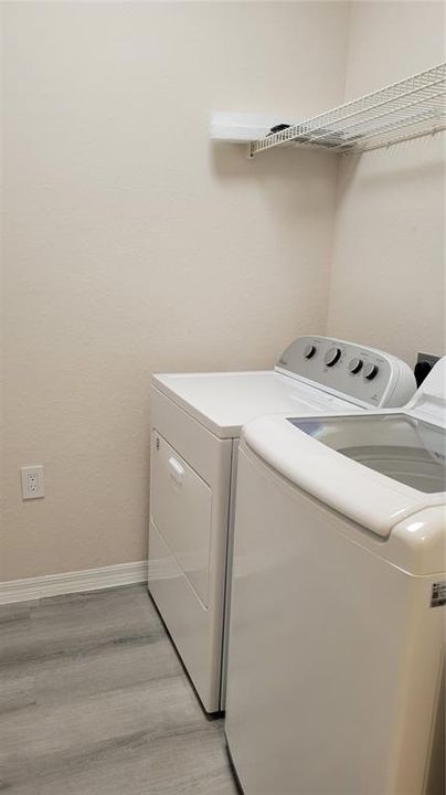 laundry room with storage