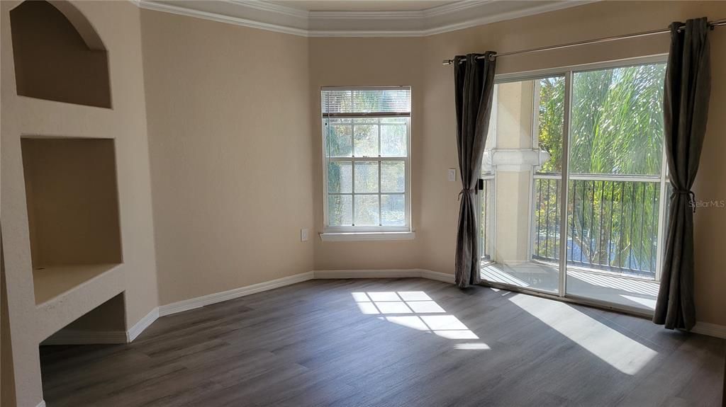 Sunshine filled living room with convenient built in entertainment center