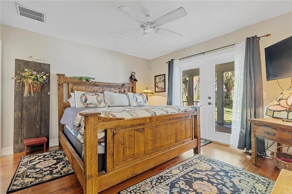 Spacious Guest Bedroom with French Door Access to the Lanai and Pool