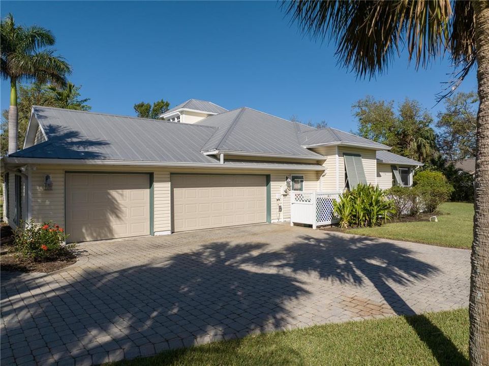 Three Car Garage and Paver Driveway