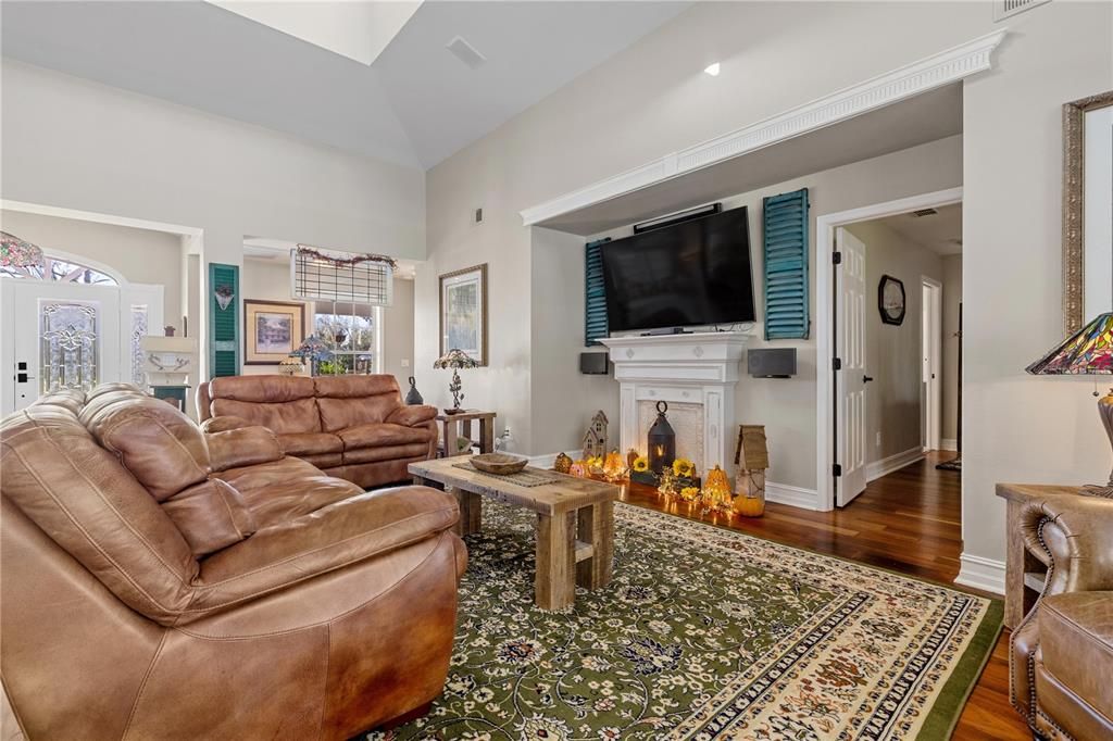 Living room with vaulted ceiling and skylight