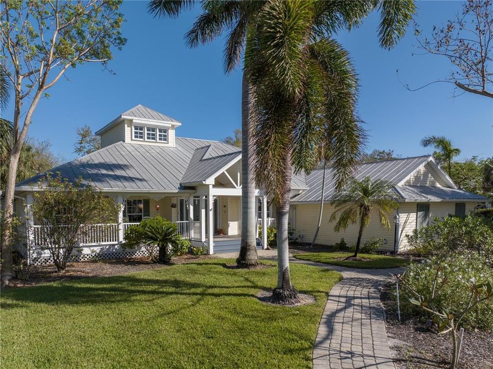 Welcome Home! Key West style home with Metal Roof and Paver Sidewalks