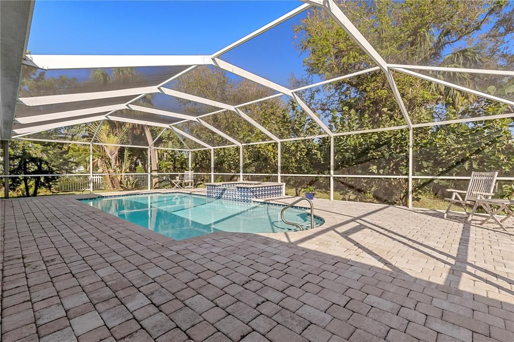 View of pool featuring an integrated, heated spa for total relaxation