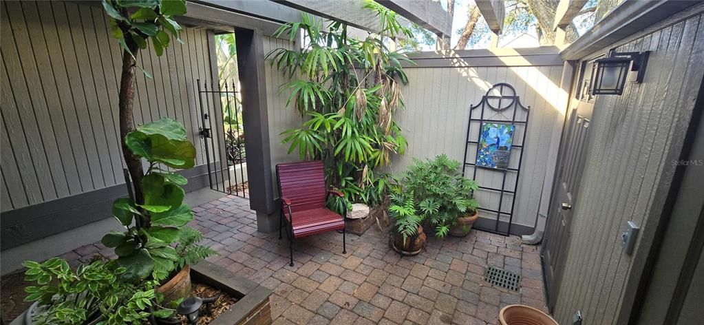 Entry patio with private storage and access from Kitchen