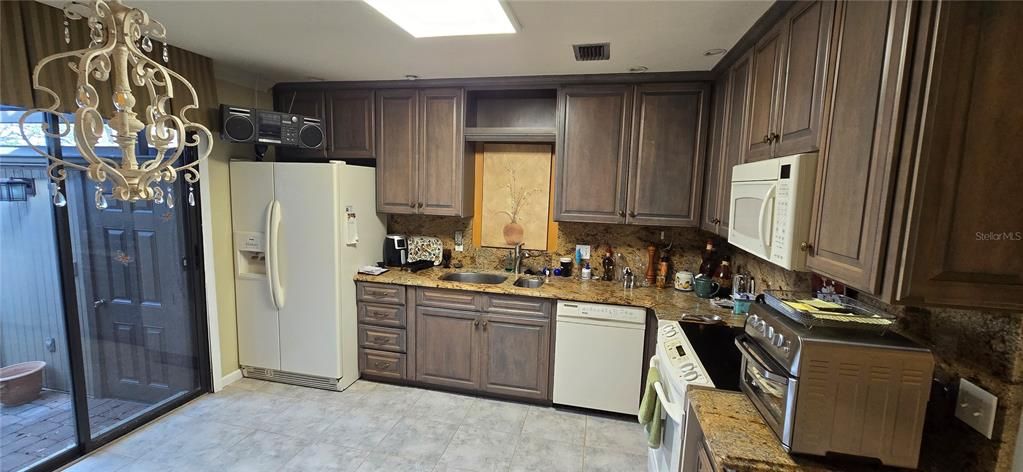 Kitchen with Custom Cabinets and Granite Counters