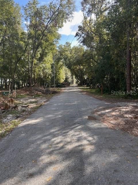 View of 64 Lyon Dr leaving the property