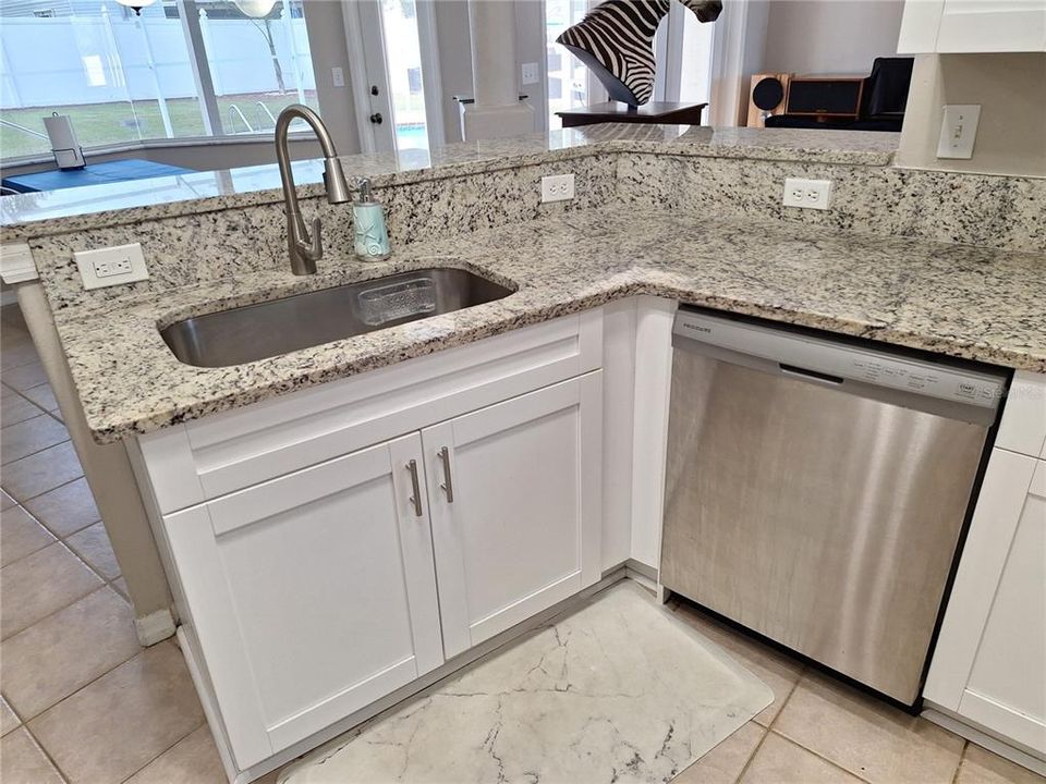 Granite is just the right touch to this awesome Kitchen.