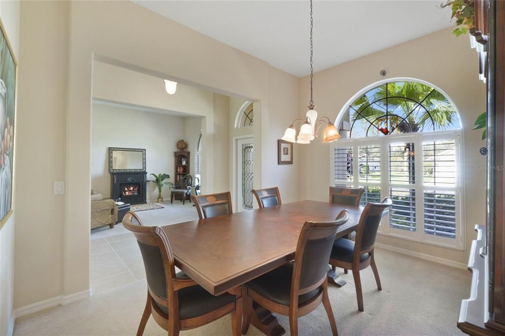 Front dining room w/ plantation shutters