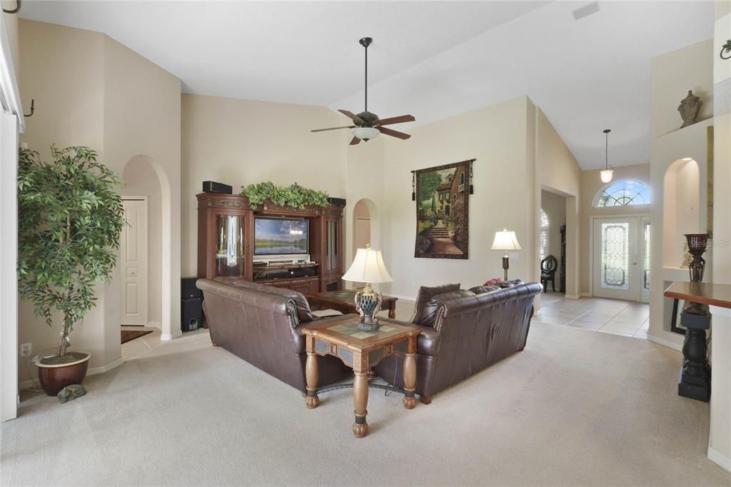 Open floor plan with large living room and vaulted ceilings