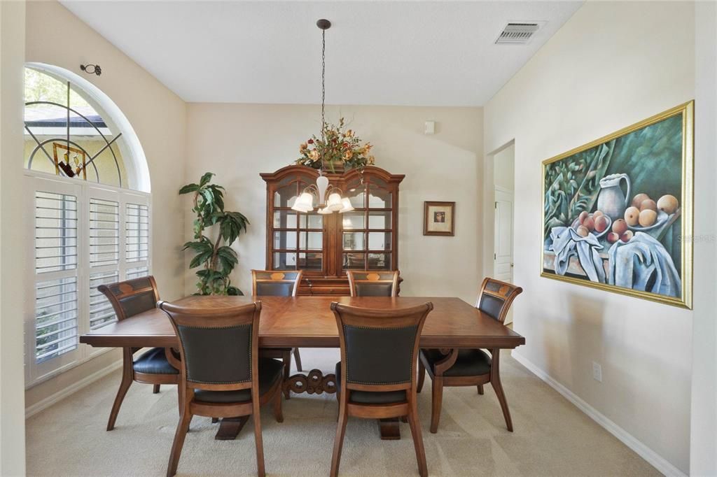 Front dining room w/ plantation shutters