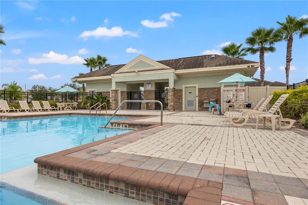 Clubhouse and Pool #1.  Virtually staged.