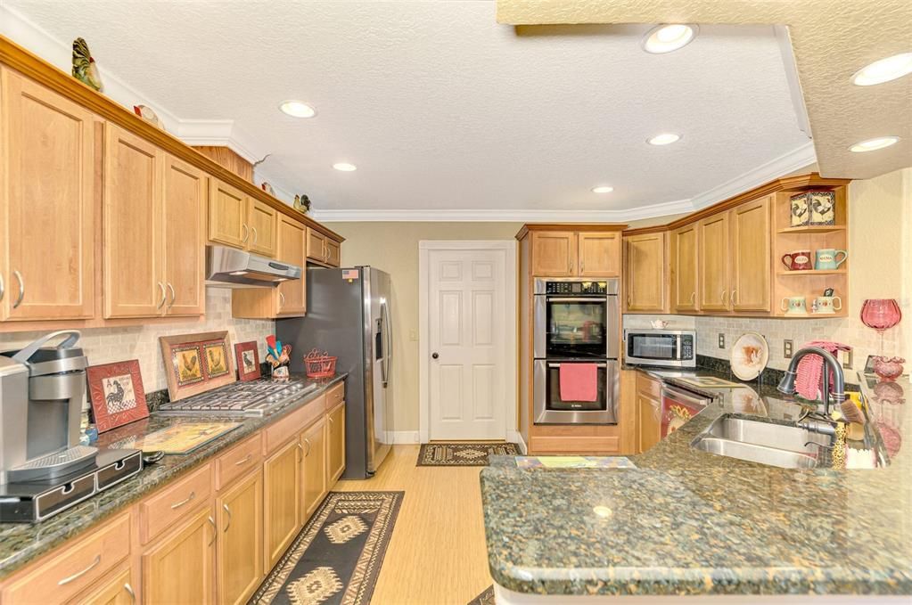 Lots of counter space, door shown leads to Indoor Laundry and into Garage through second door