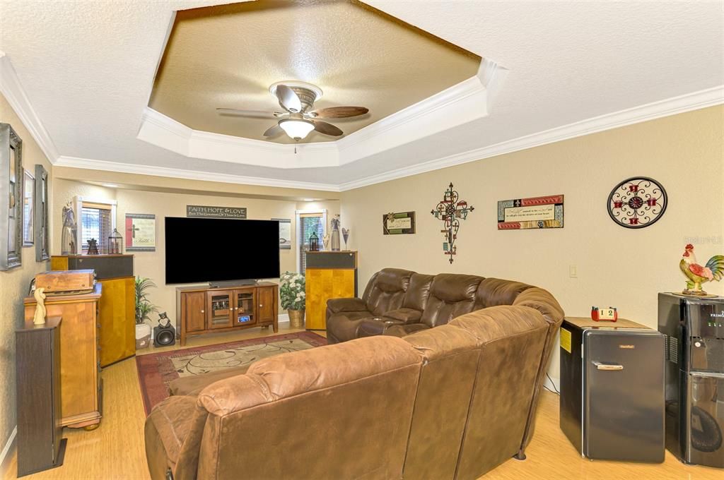 Huge Family room notice the huge fan and  crown moldings through out  this home!