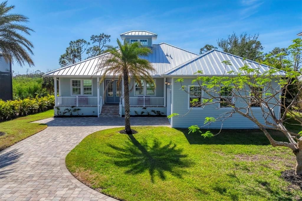 Beautiful front porch, side-entry garage.