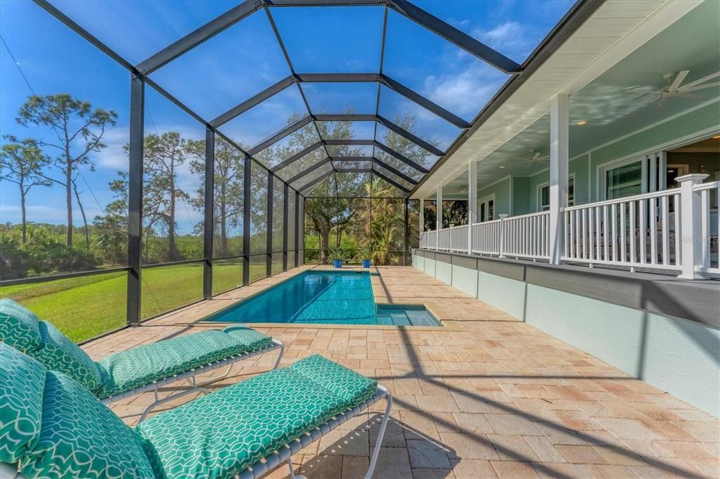 Beautiful heated salt pool with pavers.