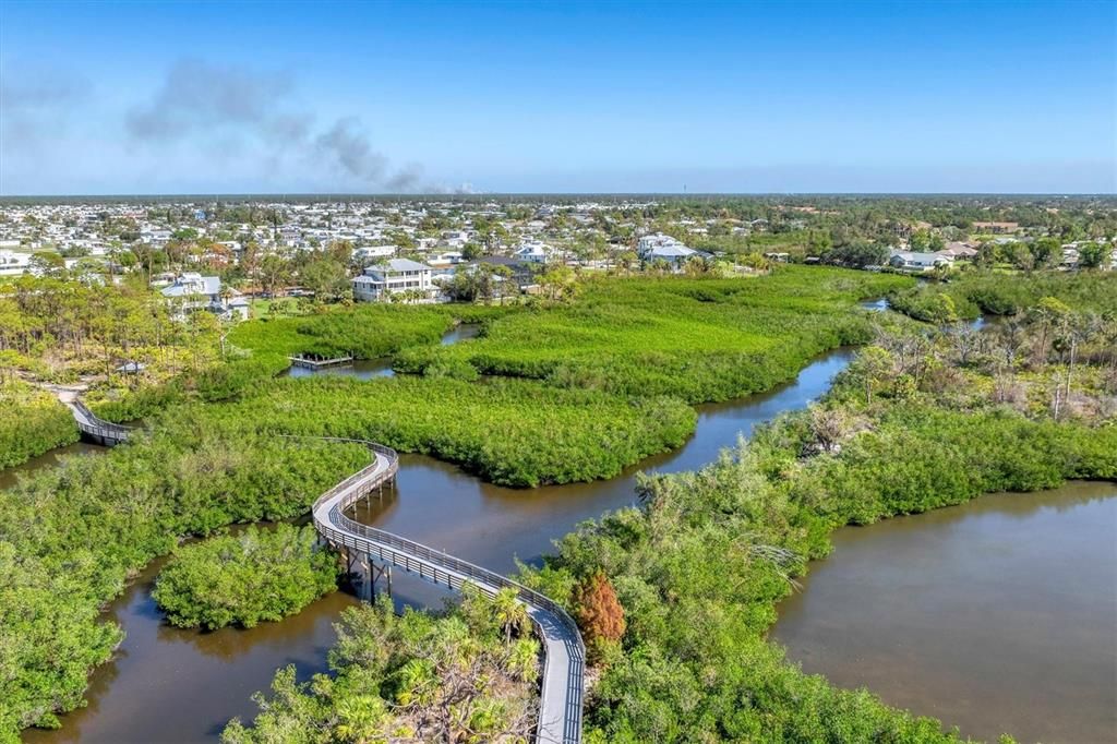 Follow the trails over footbridges to Oyster Creek Environmental Park