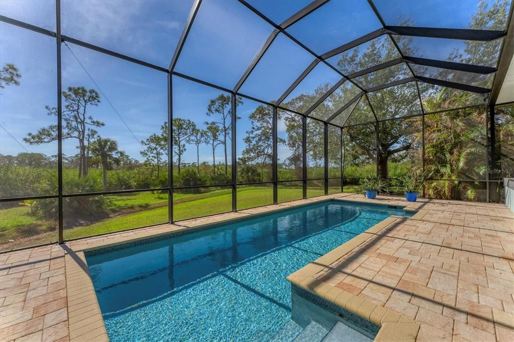 Lush greenery surrounds this property.