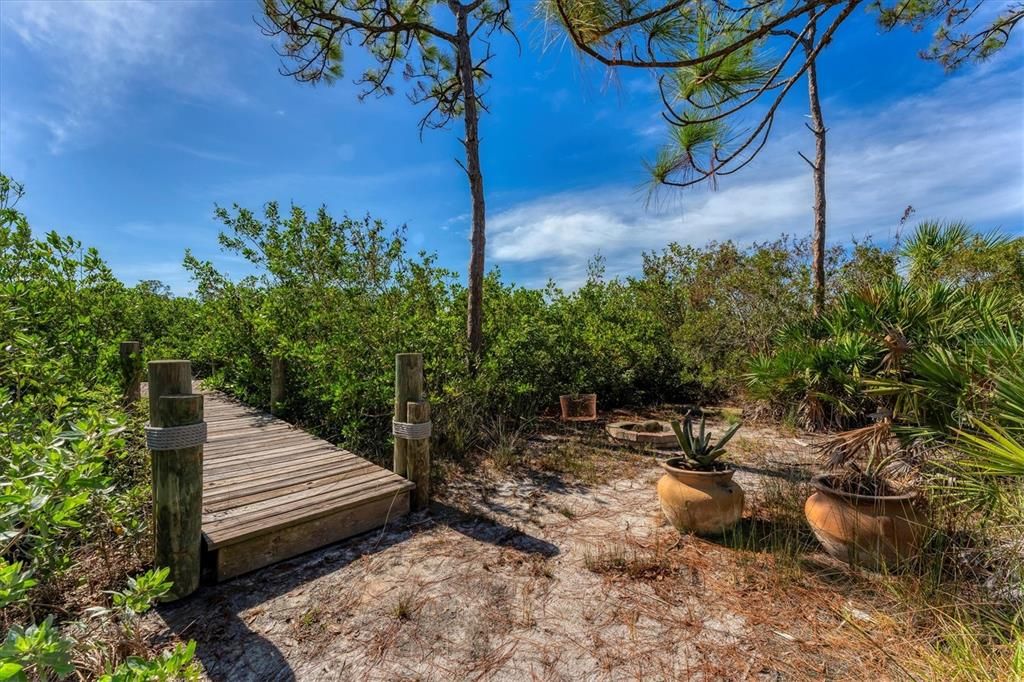 Built in firepit down by the walkway to the dock.