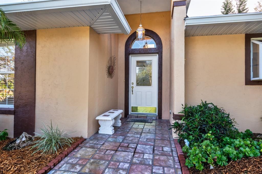 Entrance with transom window to allow natural light into home