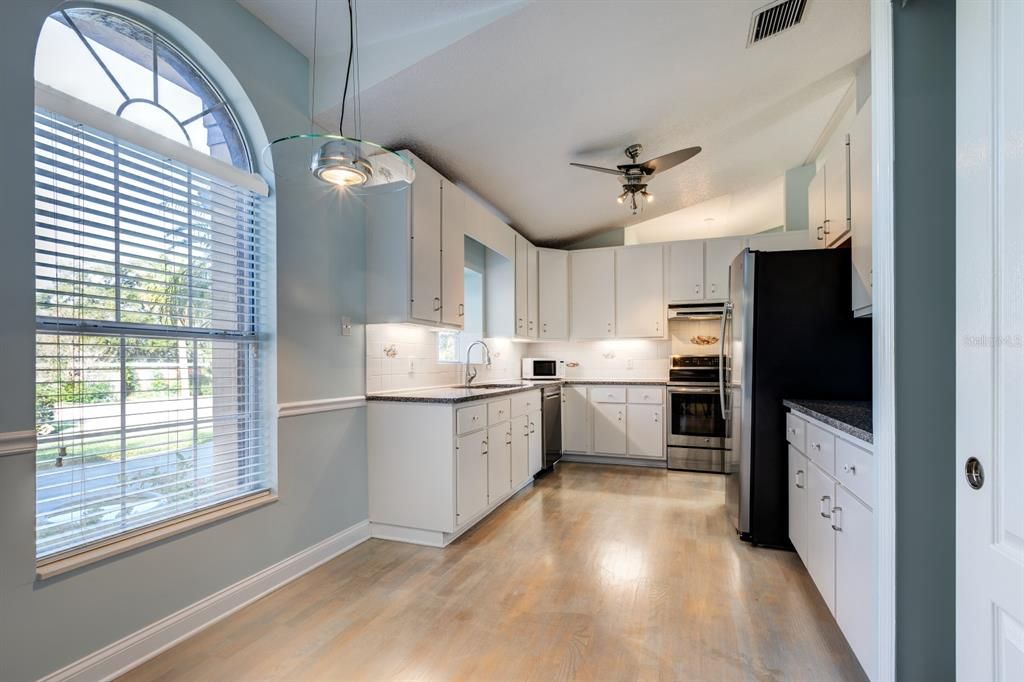 Breakfast nook area in kitchen w/ stainless steel appliances