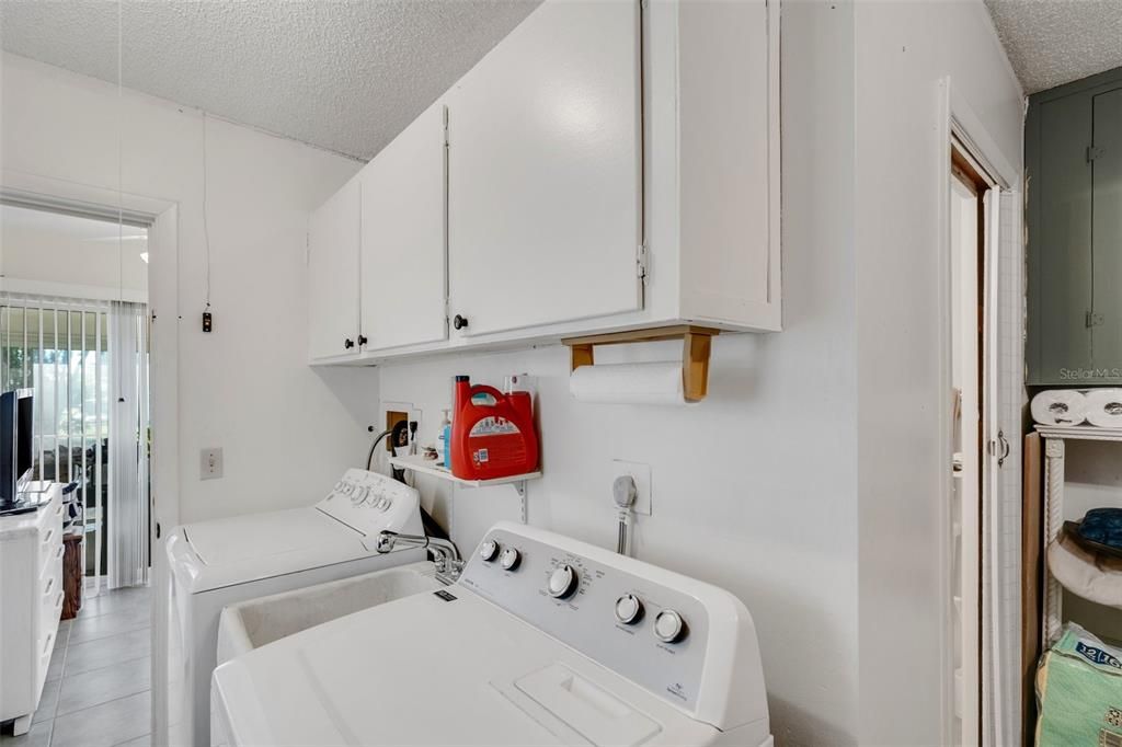 Laundry area in the garage. The door to the right is to the second bathroom.