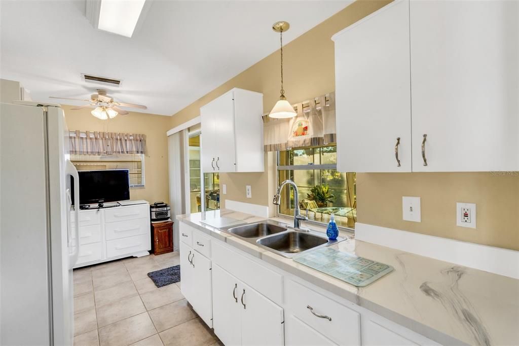 Galley Kitchen with serving window out to the Lanai.