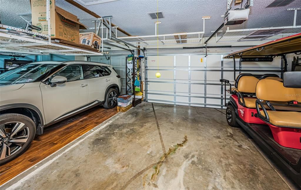 3 Car Garage features Overhead Shelves