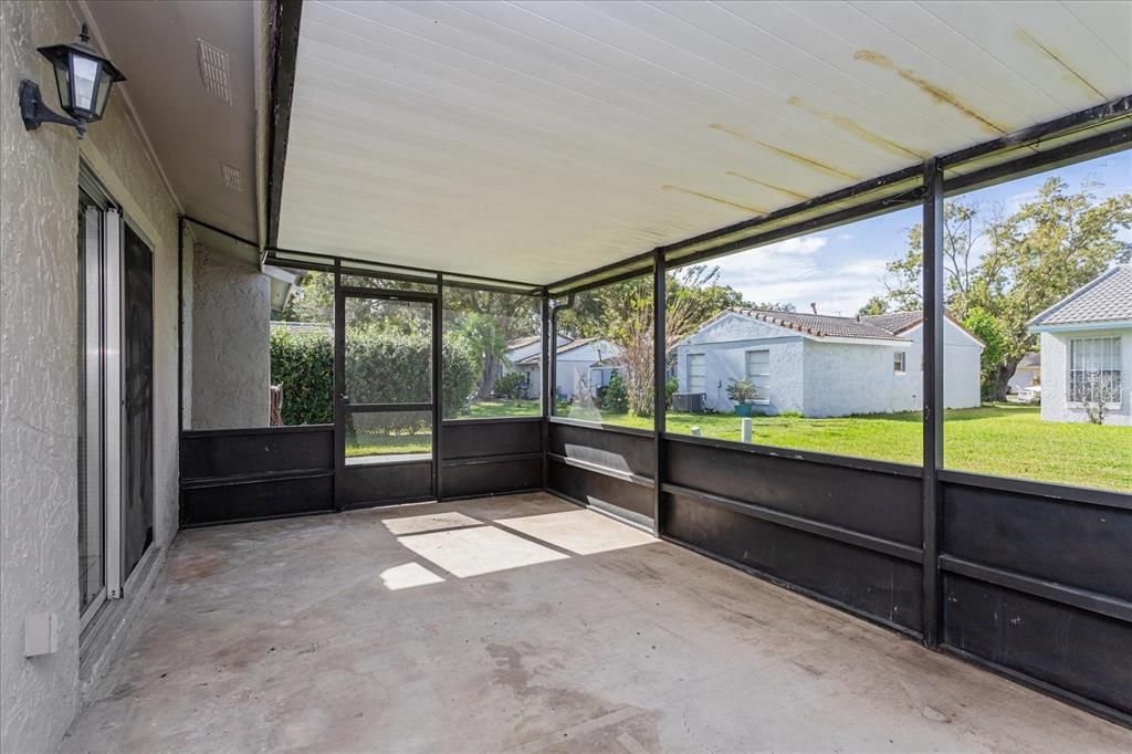 Screened In Porch view to Back Yard