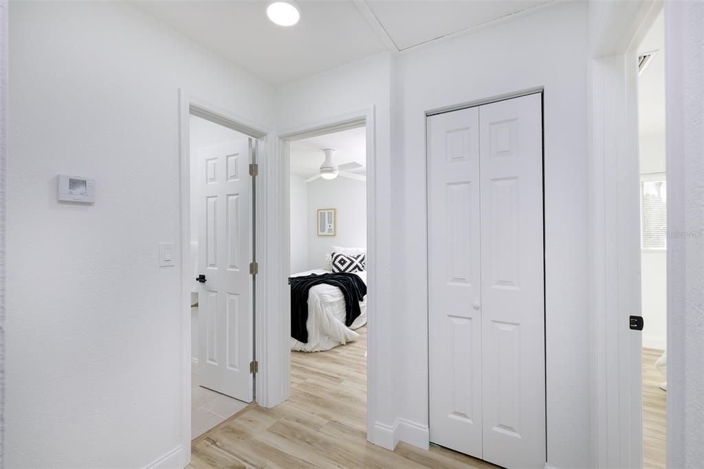 Hallway that connects 2 other bedrooms and linen closet