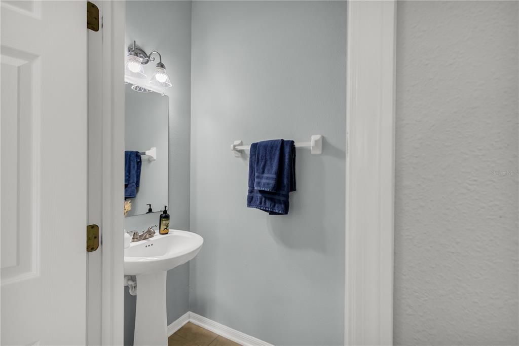 Guest bathroom on first floor, adjacent to the laundry room