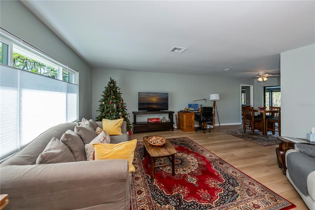 family room with big picture windows and sliders to pool