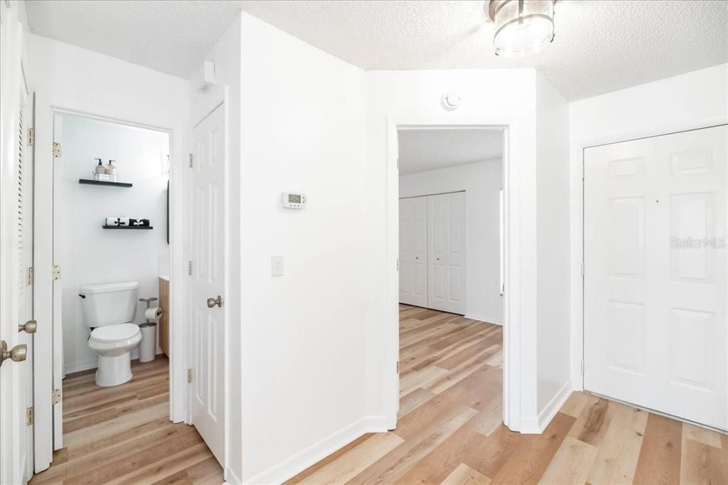 Looking into the bathroom and 2nd bedroom from entrance way