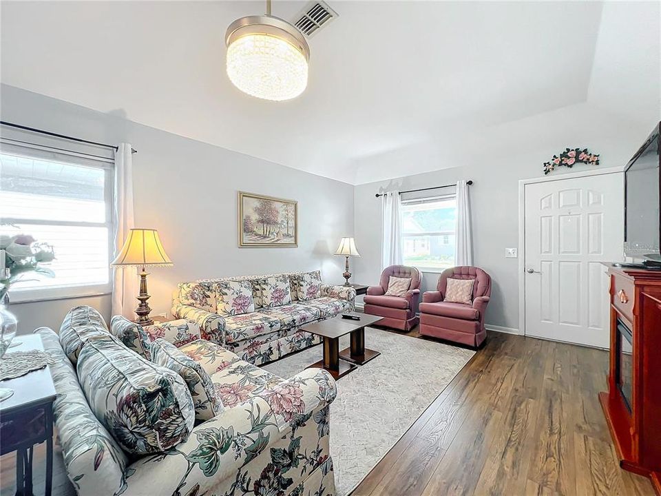 Notice the newer vinyl plank flooring throughout this home.