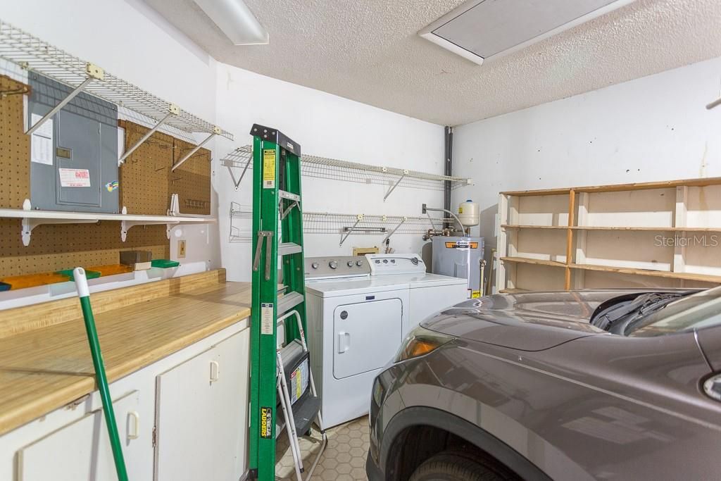 Garage with washer, dryer, air handler and hot water heater