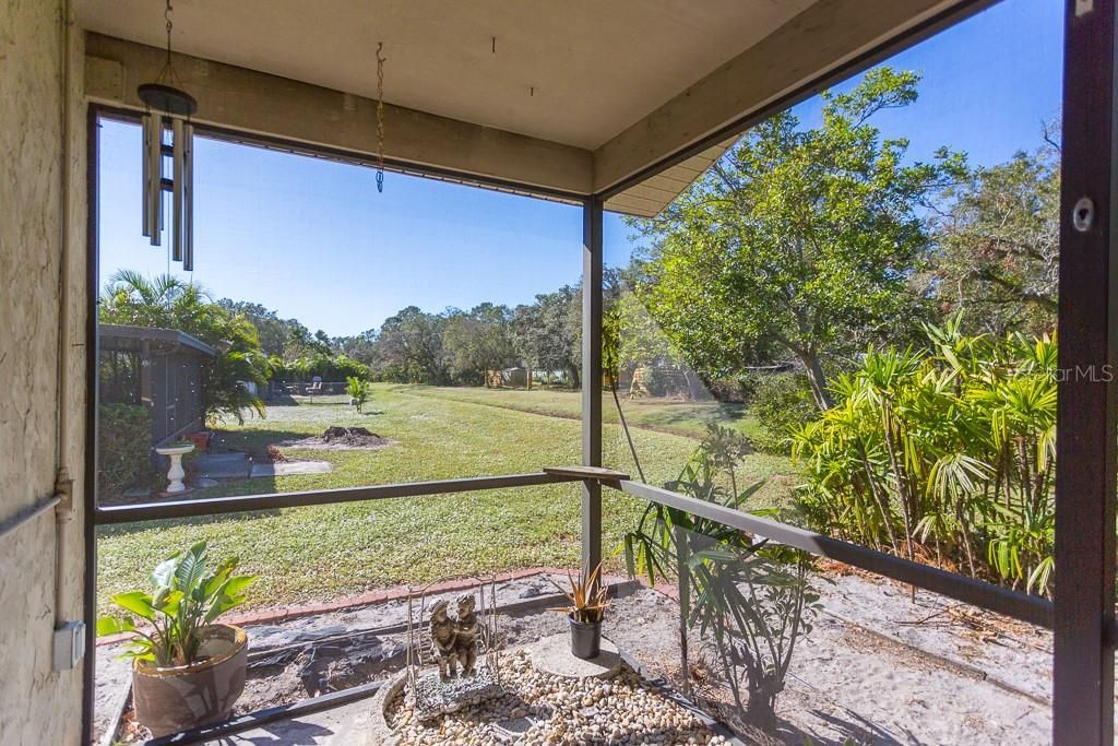 Screened lanai overlooking pond