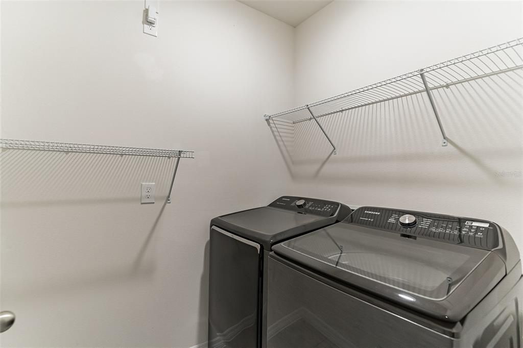 laundry room with samsung smart washer and dryer