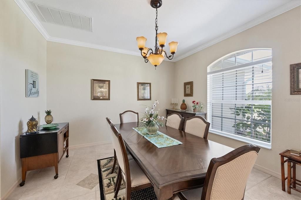 Dining Room is highlighted with crown molding & tile floors (this could be a 2nd office/hobby/workout room)