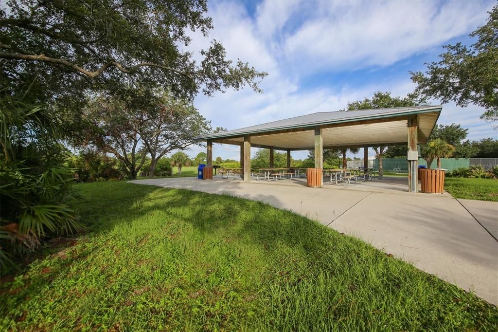 Covered community pavilion with tables for gatherings