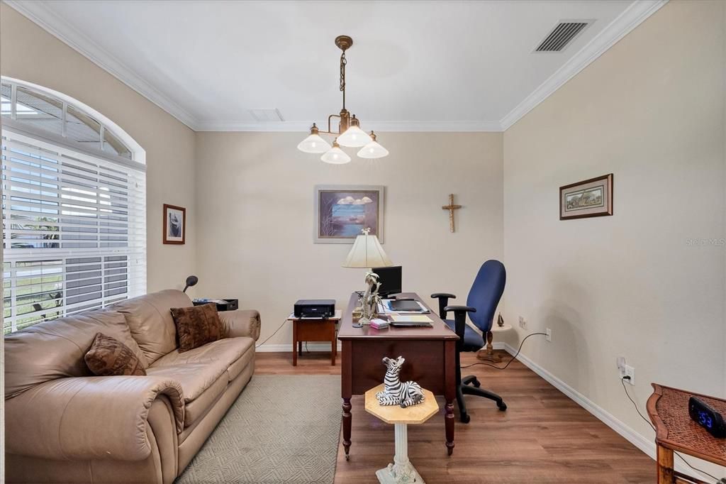 Den/Office is complimented with crown molding & LVP flooring