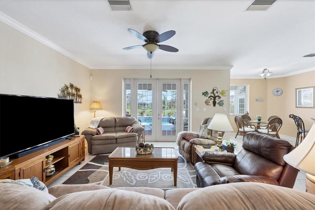 Living Room with French doors overlooking pool & lanai