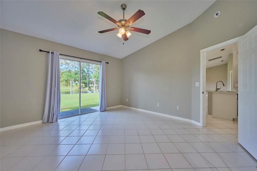 Master bedroom has vaulted ceiling and sliders that let in natural light and a gorgeous view!