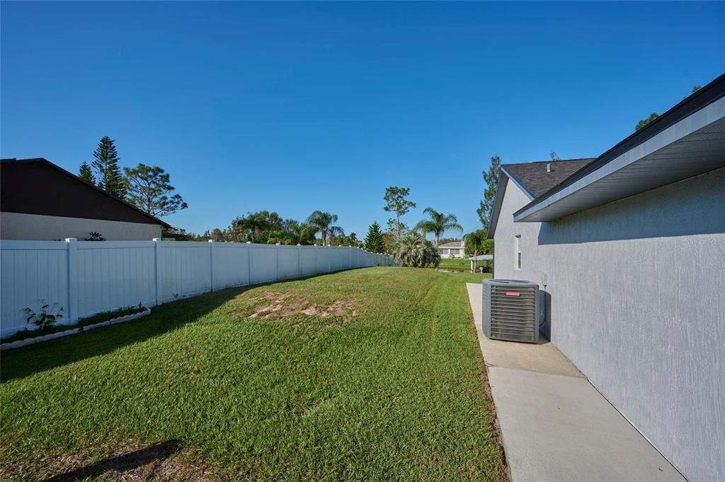 Side yard with privacy fence between neighbor's house