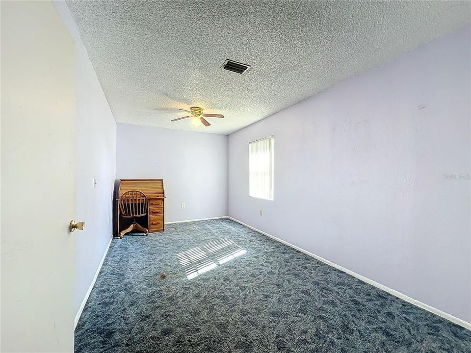 Large bedroom at the back of the home