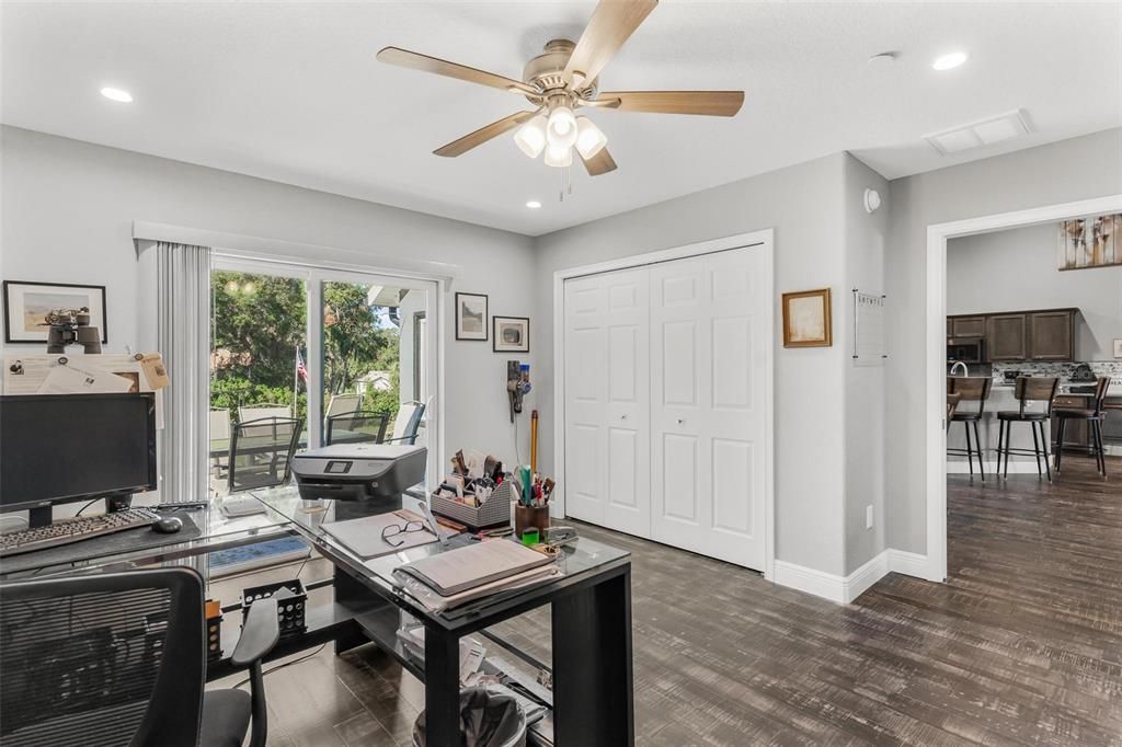 Bedroom Three/Den/Office Area with Sliding Doors leading to Patio Area